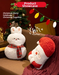 Detailed view of plush Santa Claus and white bunny dolls in a festive home setting