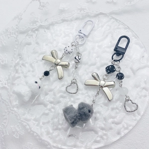 Cute plush puppy keychain with silver bow and heart charms for bags or phones