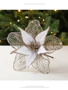 Close-up of champagne gold mesh Christmas flower with sparkling glitter on festive tree