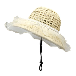 Beige lace straw sun hat for women with pearl trim and wide ruffled brim for summer beach