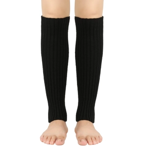 Detail of black knitted leg warmers with vertical ribbed texture for a stylish winter look