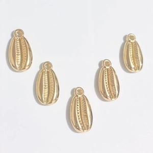 Five golden shell-shaped ABS electroplated pendants for DIY jewelry making on white background