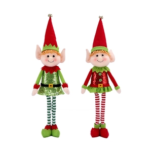 Close-up of two plush Christmas elf dolls with sequin outfits and striped long legs