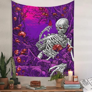 Detail of bohemian skull tapestry with butterflies and mushrooms in a cozy room setting