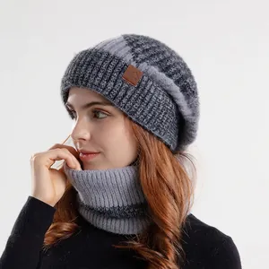 Winter two-piece set with a warm grey knit beanie and a matching striped neck warmer scarf