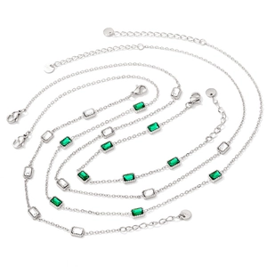 Layered stainless steel necklace and bracelet set with emerald and clear zircon gems