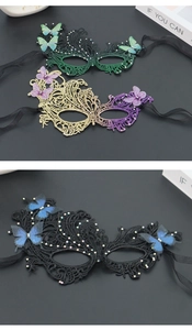 Close-up of lace masquerade mask with 3D mesh butterflies and sparkling rhinestone details