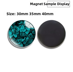 Detailed view of luminous glass fridge magnet with blue floral pattern and magnetic back