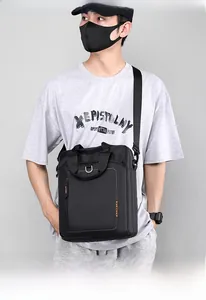 Detail showing durable black nylon material and reinforced top handle of the men briefcase