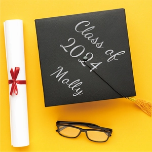 Custom silver glitter 2024 graduation cap stickers with Molly name detail on black fabric