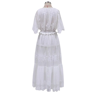 White lace embroidered v-neck maxi dress with layered ruffle skirt shown from back view