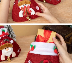 Detail of Christmas drawstring gift bags with 3D Santa and snowman appliques on wood