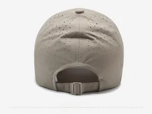 Detail of adjustable strap and laser-cut ventilation holes on khaki baseball cap