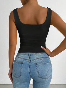 Rear view detail of black slim fit tank top with minimalist ribbed texture on back