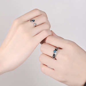 Astronaut couple rings set with blue glazed stone on silver adjustable open bands