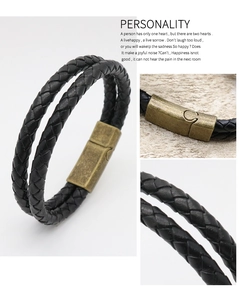 Close-up of vintage black braided leather bracelet with magnetic alloy clasp for men