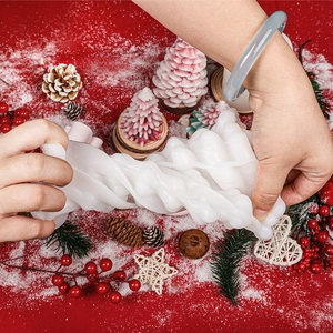 Highly flexible white silicone mold showing elasticity for DIY Christmas tree candles