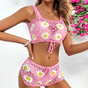 Pink crochet bikini set featuring 3D daisy flower details and side-slit knit shorts