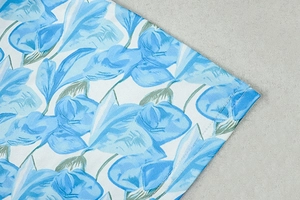 Detail of floral print mesh dress showing intricate petal texture and high-quality stitching