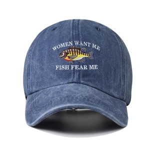 Detailed view of embroidery and fish graphic on navy blue washed cotton baseball cap