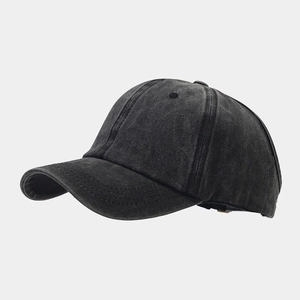 Detailed side view of dark grey washed cotton ponytail baseball cap with curved brim