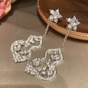 Silver flower gourd tassel earrings with sparkling zircon and hollow metal design