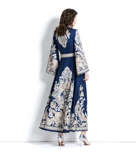 Close-up of paisley print and elegant flared sleeve detail on this long floral dress