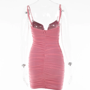 Detail view of pink ruched mesh mini dress with back zipper on a transparent mannequin