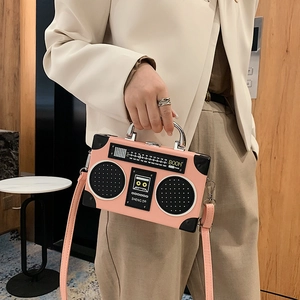 Pink retro radio-shaped novelty crossbody bag with metallic handle and boombox design