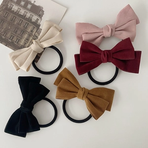 Elegante haarelastiekjes met grote stoffen strik in retrostijl in diverse vintage kleuren