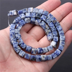 Macro view of blue and white square natural stone beads for DIY jewelry making