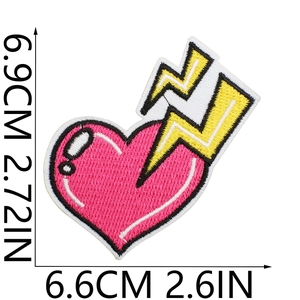 Detailed view of heart and lightning embroidery patch with precise size measurements