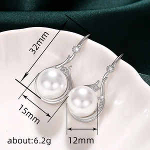 Elegant silver pearl earrings with crystals featuring 12mm white pearls and dimensions
