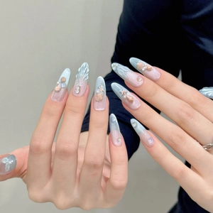 Handmade ocean-themed press-on nails with 3D fishtail, cat-eye effects and pearl accents