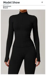 Detail of premium black sports jacket with seamless collar and ergonomic thumbholes