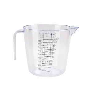 Macro view of clear plastic measuring cup with detailed ml and oz dual scale markings