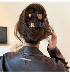 Retro tortoise hair claw with flocked bear and pearls shown on model brunette hair