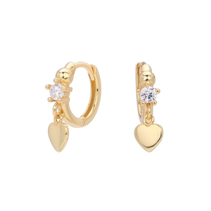 Macro shot of gold S925 sterling silver huggie earrings with heart charms and cubic zirconia