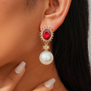 Vintage luxury earrings with oval red gemstone and large pearl pendant in gold finish