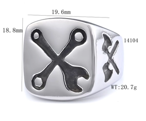 Close-up of industrial wrench and shovel relief on silver stainless steel men's ring