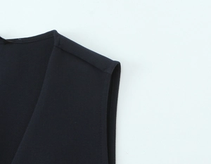 Detailed close-up of dark navy sleeveless top neckline and premium stitching quality