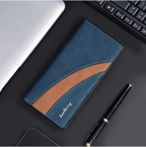 Blue and brown stitched leather long wallet for men on a professional office desk