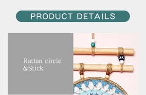 Detail of bohemian dream catcher showing rattan circle, wooden stick and blue beads