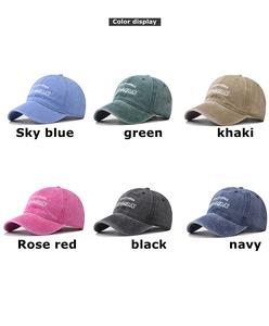 Detailed close-up showing six color options of washed cotton baseball caps with embroidery