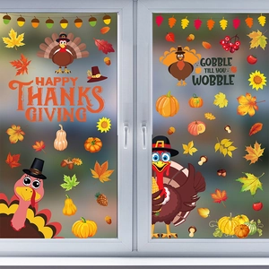 Detail view of Thanksgiving static window clings with turkey, maple leaves, and pumpkins