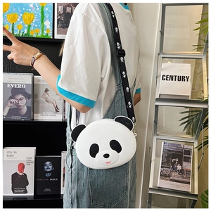 Close-up of a cute panda-shaped white silicone crossbody bag with a black patterned strap