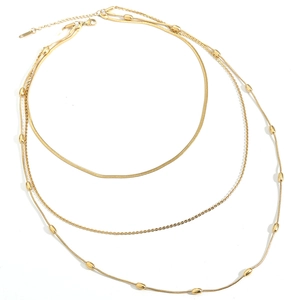 Collier double couche doré minimaliste avec chaîne serpent et perles métalliques