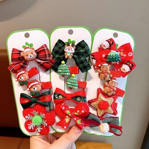 Christmas hair clips set featuring snowman, reindeer and ribbon bows for kids