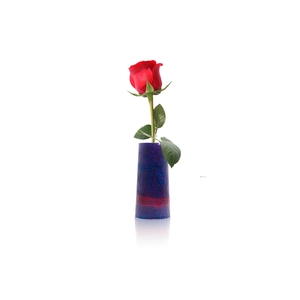 Close-up of gradient stripe resin vase with glitter texture and a red rose flower