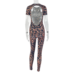 Leopard print bodysuit featuring a deep open back design and short sleeves on a white background